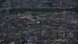 5.5K aerial stock footage of circling the top of BT Tower, London, England, twilight Aerial Stock Footage | AX116_099