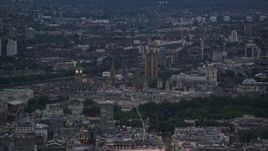 5.5K aerial stock footage of flying by Big Ben, Parliament, and Westminster Abbey in London, England, night Aerial Stock Footage | AX116_100