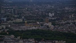 5.5K aerial stock footage of flying by Big Ben and the British Parliament in London, England, night Aerial Stock Footage | AX116_109