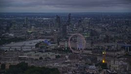 5.5K aerial stock footage of vast cityscape seen from London Eye and Big Ben by River Thames, London, England, night Aerial Stock Footage | AX116_116E