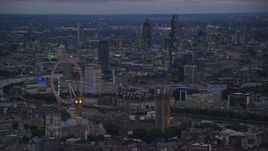 5.5K aerial stock footage passing London Eye, Big Ben and British Parliament, London, England, night Aerial Stock Footage | AX116_119