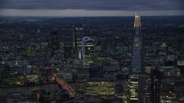 5.5K aerial stock footage of flying by The Shard and Central London skyscrapers, London, England, night Aerial Stock Footage | AX116_152E