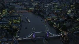5.5K aerial stock footage orbiting Tower Bridge and River Thames near Tower of London, England, night Aerial Stock Footage | AX116_157E