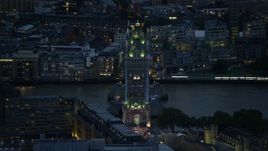 5.5K aerial stock footage of passing the famous Tower Bridge over River Thames, London, England, night Aerial Stock Footage | AX116_164E
