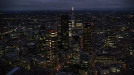 5.5K aerial stock footage orbiting Central London skyscrapers with The Shard in background, England, night Aerial Stock Footage | AX116_169