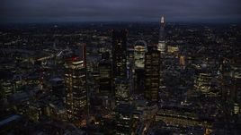 5.5K aerial stock footage of passing by Central London skyscrapers, The Shard in background, England, night Aerial Stock Footage | AX116_170