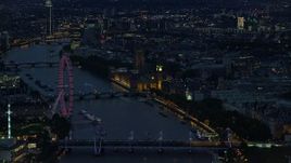 5.5K aerial stock footage flyby London Eye, Big Ben and Parliament, River Thames bridges, London, England, night Aerial Stock Footage | AX116_177E