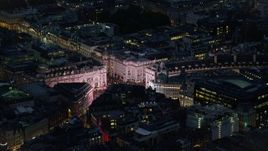 5.5K aerial stock footage of the bright lights of Piccadilly Circus, London, England, night Aerial Stock Footage | AX116_179E