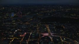 5.5K aerial stock footage fly past Piccadilly Circus, with a view of London Eye and Big Ben, London, England, night Aerial Stock Footage | AX116_188