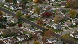 5.5K aerial stock footage of suburban homes in Autumn, Massapequa, New York Aerial Stock Footage | AX117_006