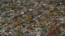 5.5K aerial stock footage approaching a suburban homes in Autumn, North Bellmore, New York Aerial Stock Footage | AX117_017E