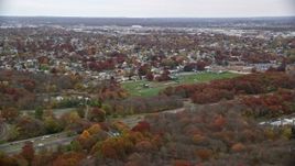 5.5K aerial stock footage fly over suburbs and nature preserve toward high school in Autumn, Massapequa, New York Aerial Stock Footage | AX117_055E