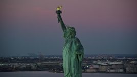 5.5K aerial stock footage of an orbit of the Statue of Liberty at sunrise, New York Aerial Stock Footage | AX118_050E