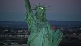 5.5K aerial stock footage of orbiting the famous Statue of Liberty at sunrise, New York Aerial Stock Footage | AX118_058E