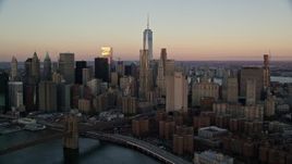 5.5K aerial stock footage of a view of Lower Manhattan's skyscrapers at sunrise in New York City Aerial Stock Footage | AX118_071E
