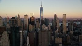5.5K aerial stock footage of the top of Freedom Tower and Lower Manhattan skyscrapers at sunrise in New York City Aerial Stock Footage | AX118_075