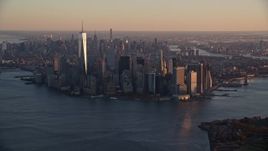 5.5K aerial stock footage of a slow approach to Lower Manhattan at sunrise, New York City Aerial Stock Footage | AX118_083
