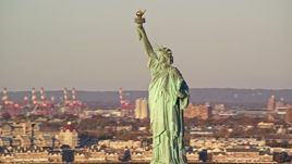 5.5K aerial stock footage orbit the historic Statue of Liberty monument at sunrise in New York Aerial Stock Footage | AX118_104