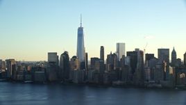 5.5K aerial stock footage of approaching the Lower Manhattan skyline at sunrise in New York City Aerial Stock Footage | AX118_149E