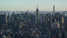 5.5K aerial stock footage of historic Empire State Building and Midtown at sunrise in New York City Aerial Stock Footage | AX118_168E