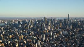 5.5K aerial stock footage of a wide view of skyscrapers in Midtown Manhattan at sunrise in New York City Aerial Stock Footage | AX118_171E