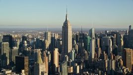 5.5K aerial stock footage of approaching the towering Empire State Building at sunrise in New York City Aerial Stock Footage | AX118_177E