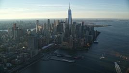 5.5K aerial stock footage of a wide view of Lower Manhattan's skyscrapers at sunrise in New York City Aerial Stock Footage | AX118_211E