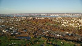 5.5K aerial stock footage of freeway and cemetery at sunrise in Jersey City, New Jersey Aerial Stock Footage | AX118_220E