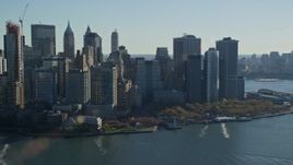 5.5K aerial stock footage of Battery Park and skyscrapers in Autumn, Lower Manhattan, New York City Aerial Stock Footage | AX119_015E