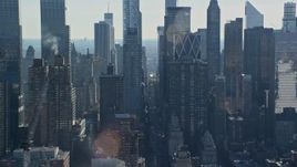 5.5K aerial stock footage of flying by skyscrapers in Hell's Kitchen in Midtown, New York City Aerial Stock Footage | AX119_030E
