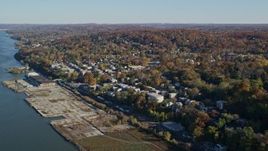 5.5K aerial stock footage video of riverfront homes in Hastings on Hudson, New York, in Autumn Aerial Stock Footage | AX119_074E