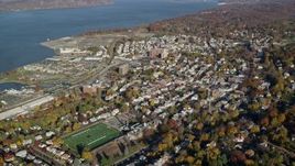 5.5K aerial stock footage of riverfront town of Sleepy Hollow in Autumn, New York Aerial Stock Footage | AX119_088E