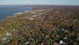 5.5K aerial stock footage of a small riverfront town in Autumn, Briarcliff Manor and Ossining, New York Aerial Stock Footage | AX119_111E