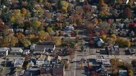 5.5K aerial stock footage of homes near a small town street intersection in Autumn, Croton on Hudson, New York Aerial Stock Footage | AX119_130