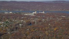 5.5K aerial stock footage of a view of Indian Point Nuclear Power Plant in Autumn, Buchanan, New York Aerial Stock Footage | AX119_140E