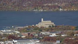 5.5K aerial stock footage of a riverfront factory in Autumn, Peekskill, New York Aerial Stock Footage | AX119_142