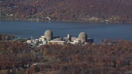 5.5K aerial stock footage of the riverfront Indian Point Nuclear Plant in Autumn, Buchanan, New York Aerial Stock Footage | AX119_143E