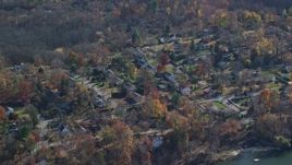 5.5K aerial stock footage of a lakeside neighborhood in Autumn, Mohegan Lake, New York Aerial Stock Footage | AX119_197