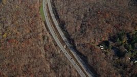 5.5K aerial stock footage of forest highway in Autumn, Yorktown Heights, New York Aerial Stock Footage | AX119_200