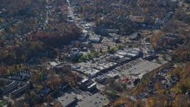 5.5K aerial stock footage of a small town shopping center in Autumn, Mt Kisco, New York Aerial Stock Footage | AX119_210E