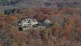 5.5K aerial stock footage of an isolated hilltop mansion in Autumn, Mt Kisco, New York Aerial Stock Footage | AX119_214
