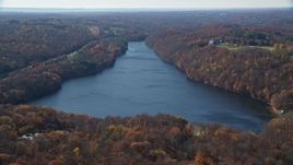 5.5K aerial stock footage orbit reservoir in Autumn, Mt Kisco, New York Aerial Stock Footage | AX119_215
