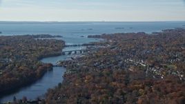 5.5K aerial stock footage of a small town community and bridges over river in Autumn, Greenwich, Connecticut Aerial Stock Footage | AX119_229E