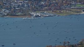 5.5K aerial stock footage of sailboats near a marina in Autumn, Oyster Bay, New York Aerial Stock Footage | AX119_241