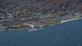 5.5K aerial stock footage of an orbit of sailboats near a marina in Autumn, Oyster Bay, New York Aerial Stock Footage | AX119_242