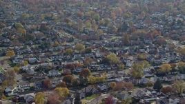 5.5K aerial stock footage of suburban neighborhoods in Autumn, Massapequa, New York Aerial Stock Footage | AX120_008E