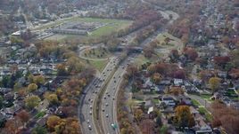 5.5K aerial stock footage of a view of light traffic on a freeway in Autumn, North Bellmore, New York Aerial Stock Footage | AX120_018