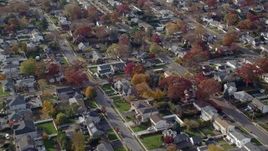 5.5K aerial stock footage approach quiet suburban neighborhoods in Autumn, North Bellmore, New York Aerial Stock Footage | AX120_019E