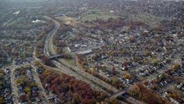5.5K aerial stock footage approach suburban neighborhoods and freeway in Autumn, Uniondale, New York Aerial Stock Footage | AX120_024