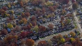 5.5K aerial stock footage of rows of suburban homes in Autumn, Uniondale, New York Aerial Stock Footage | AX120_025E